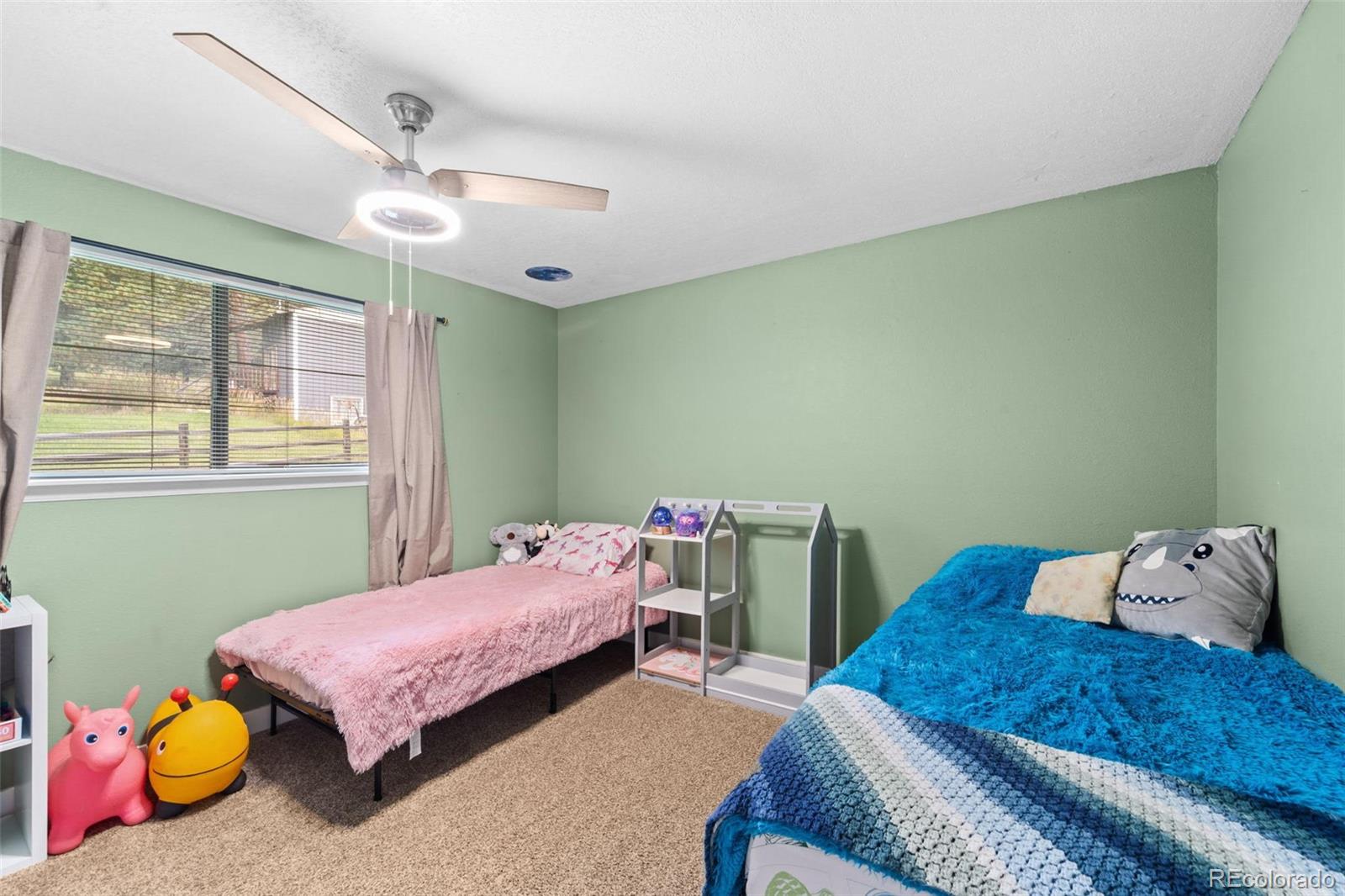 10829 Bartlett Trail Rye, CO 81069 - Photo 12 of 40 a bedroom with a bed and a window