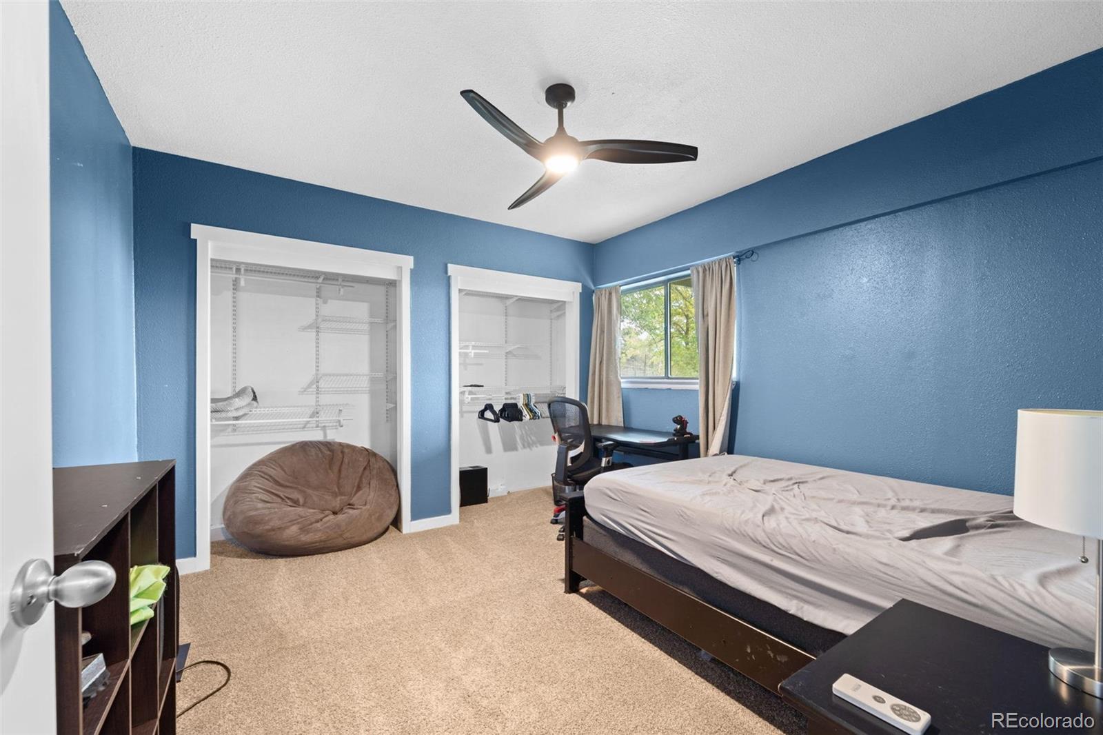 10829 Bartlett Trail Rye, CO 81069 - Photo 17 of 40 a bedroom with a bed and window