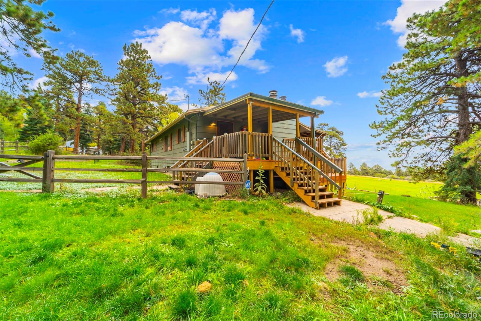 10829 Bartlett Trail Rye, CO 81069 - Photo 25 of 40 a view of a house with a big yard