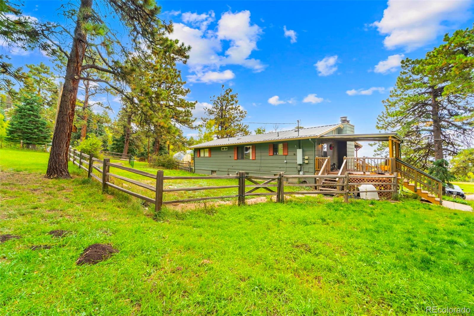 10829 Bartlett Trail Rye, CO 81069 - Photo 26 of 40 a view of a house with backyard porch and sitting area