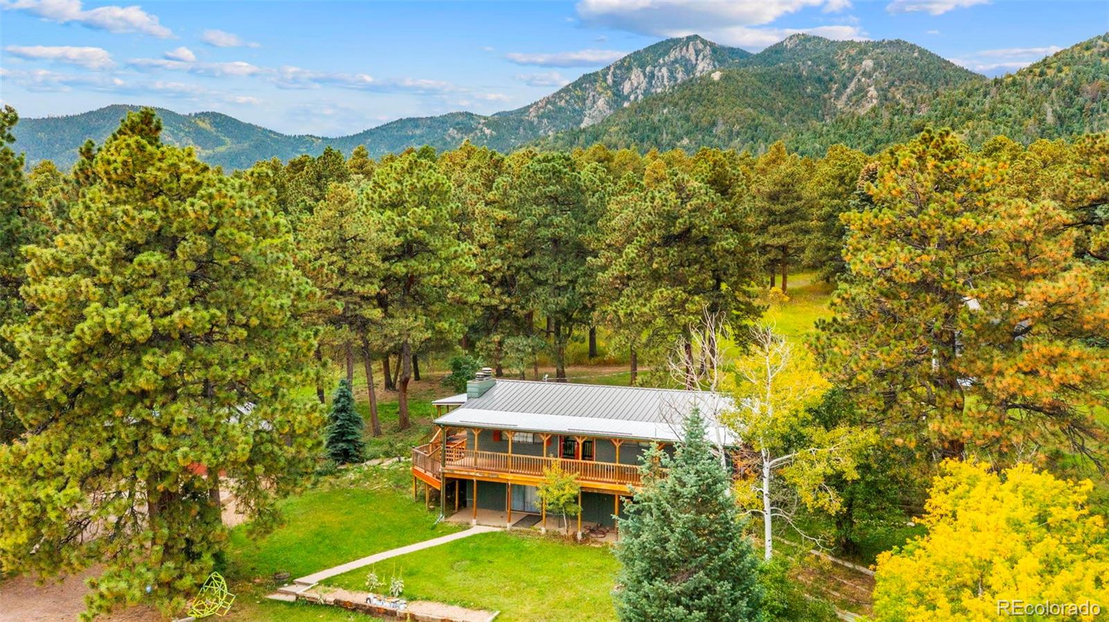 10829 Bartlett Trail Rye, CO 81069 - Photo 32 of 40 aerial view of a house with a big yard and large trees