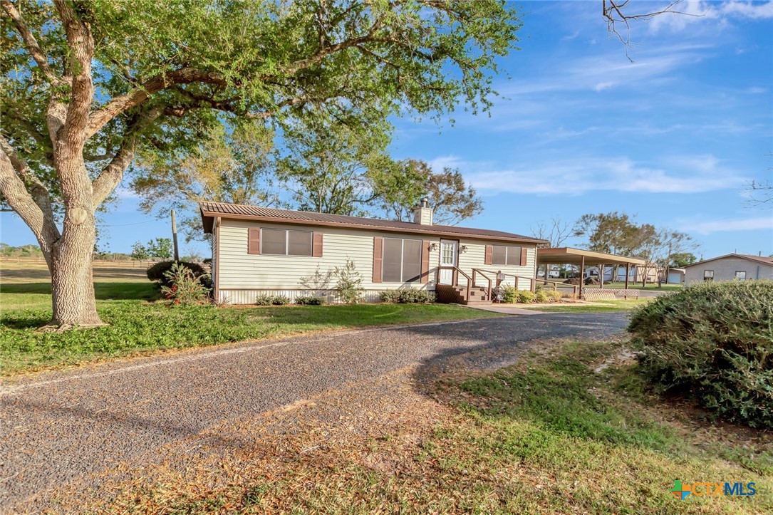 293 County Road 406 Edna, TX 77957 - Photo 1 of 48 a front view of a house with yard and green space
