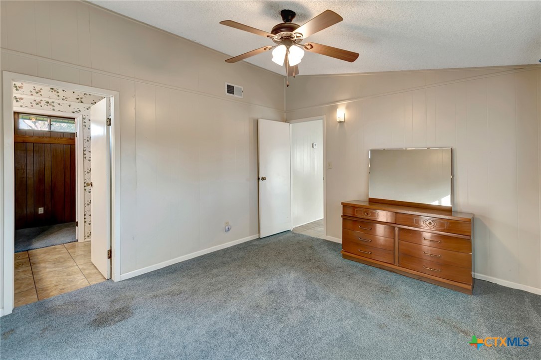 293 County Road 406 Edna, TX 77957 - Photo 23 of 48 wooden floor in an empty room with a window