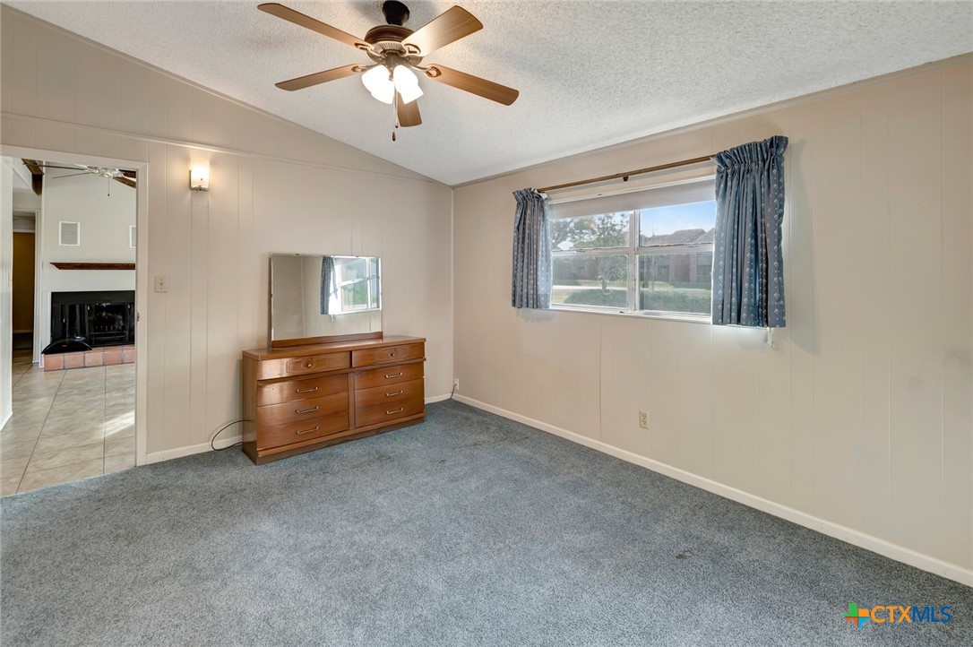 293 County Road 406 Edna, TX 77957 - Photo 24 of 48 a room with chandelier fan and windows