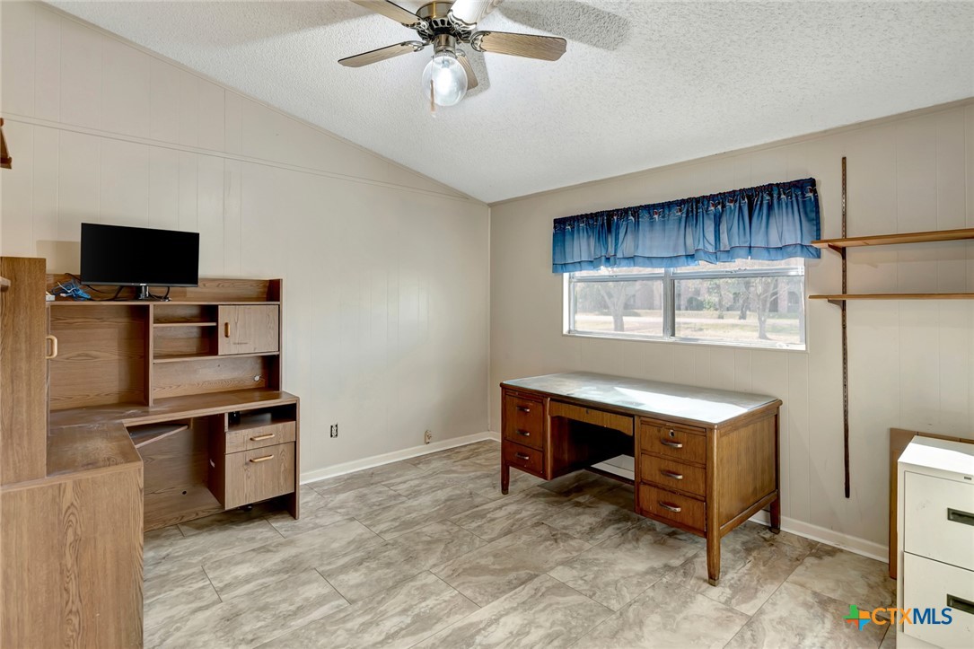 293 County Road 406 Edna, TX 77957 - Photo 32 of 48 a room with furniture and a flat screen tv