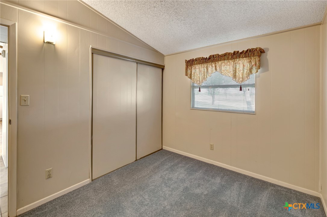 293 County Road 406 Edna, TX 77957 - Photo 35 of 48 an empty room with windows and closet