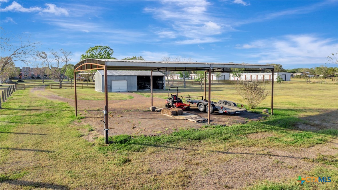 293 County Road 406 Edna, TX 77957 - Photo 43 of 48 a view of a house with backyard and sitting area