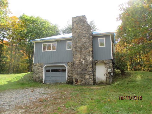 93 Winchester Road Norfolk, CT 06058 - Photo 1 of 1 a backyard of a house with oven and garden