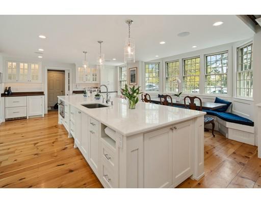 451 Main Street Hingham, MA 02043 - Photo 1 of 35 a large kitchen with kitchen island a sink appliances and a counter space