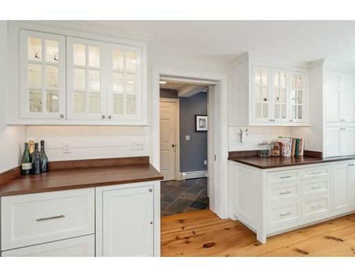 451 Main Street Hingham, MA 02043 - Photo 12 of 35 a kitchen with granite countertop a sink and a stove
