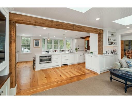 451 Main Street Hingham, MA 02043 - Photo 13 of 35 a living room with furniture and a kitchen view