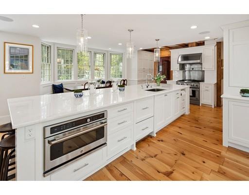 451 Main Street Hingham, MA 02043 - Photo 14 of 35 a kitchen with stainless steel appliances granite countertop a stove a sink and a microwave