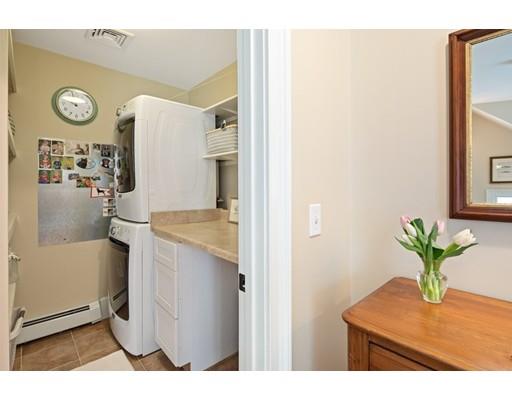 451 Main Street Hingham, MA 02043 - Photo 26 of 35 a bathroom with a sink a toilet and a mirror