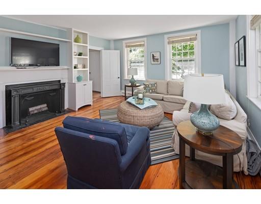 451 Main Street Hingham, MA 02043 - Photo 35 of 35 a living room with furniture a flat screen tv and a fireplace