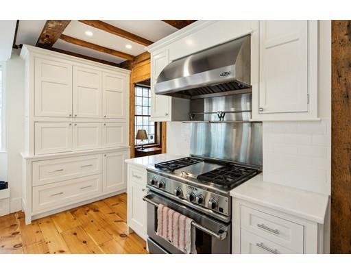 451 Main Street Hingham, MA 02043 - Photo 10 of 35 a kitchen with white cabinets and appliances