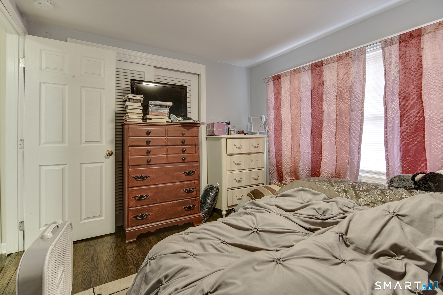 183 Sugar Street Newtown, CT 06470 - Photo 11 of 40 a bedroom with a bed and a dresser