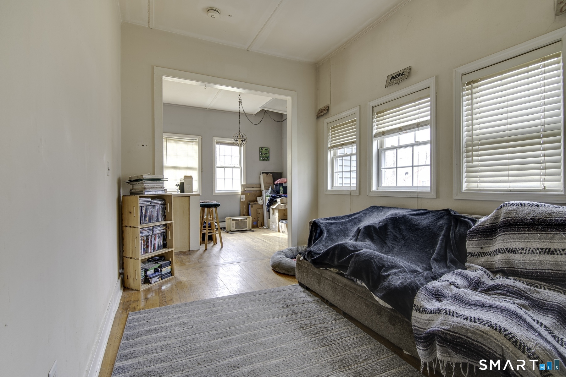 183 Sugar Street Newtown, CT 06470 - Photo 12 of 40 a living room with furniture and a large window