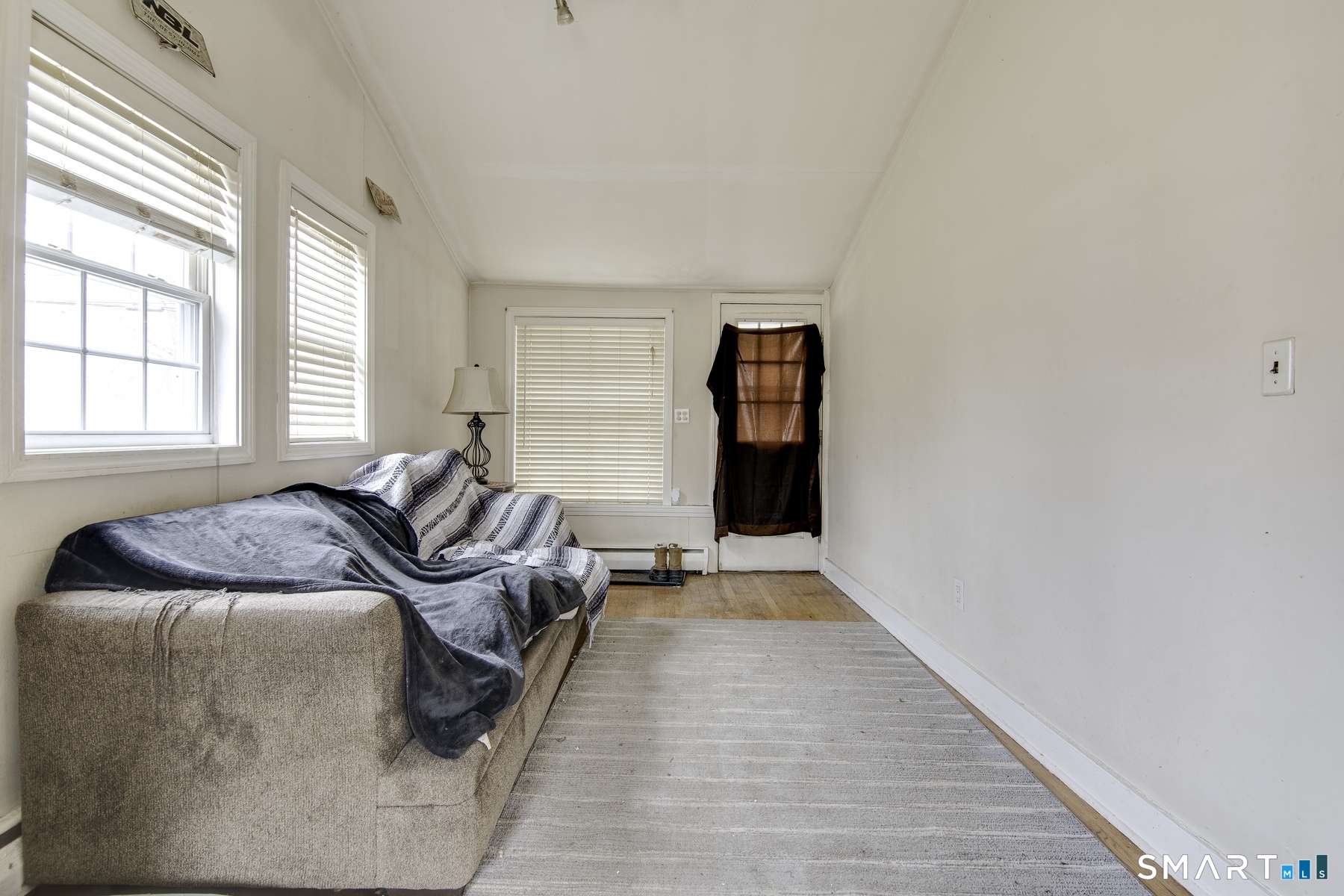 183 Sugar Street Newtown, CT 06470 - Photo 13 of 40 a living room with furniture and a window