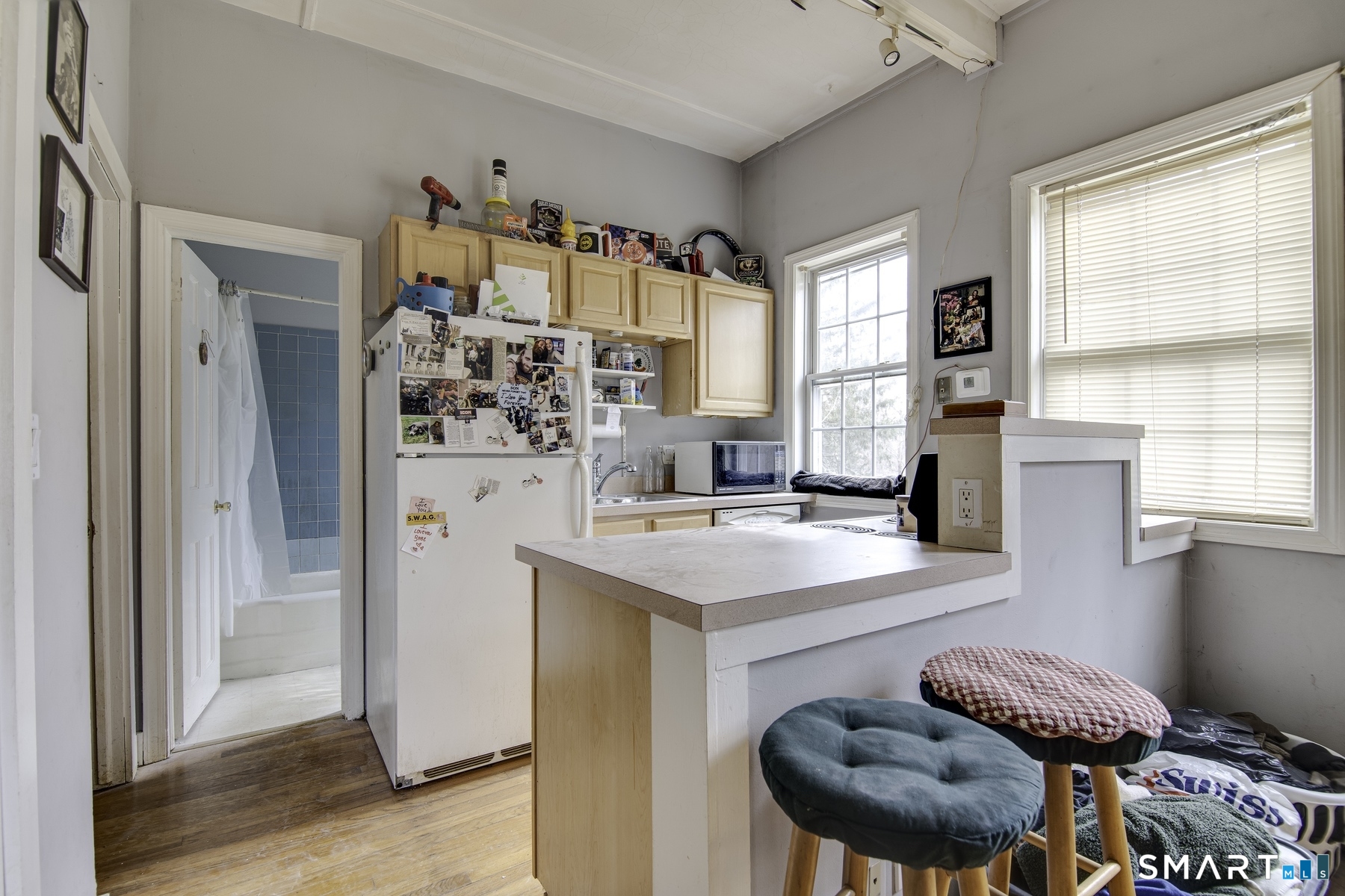 183 Sugar Street Newtown, CT 06470 - Photo 14 of 40 a kitchen with stainless steel appliances granite countertop a stove a refrigerator and a refrigerator