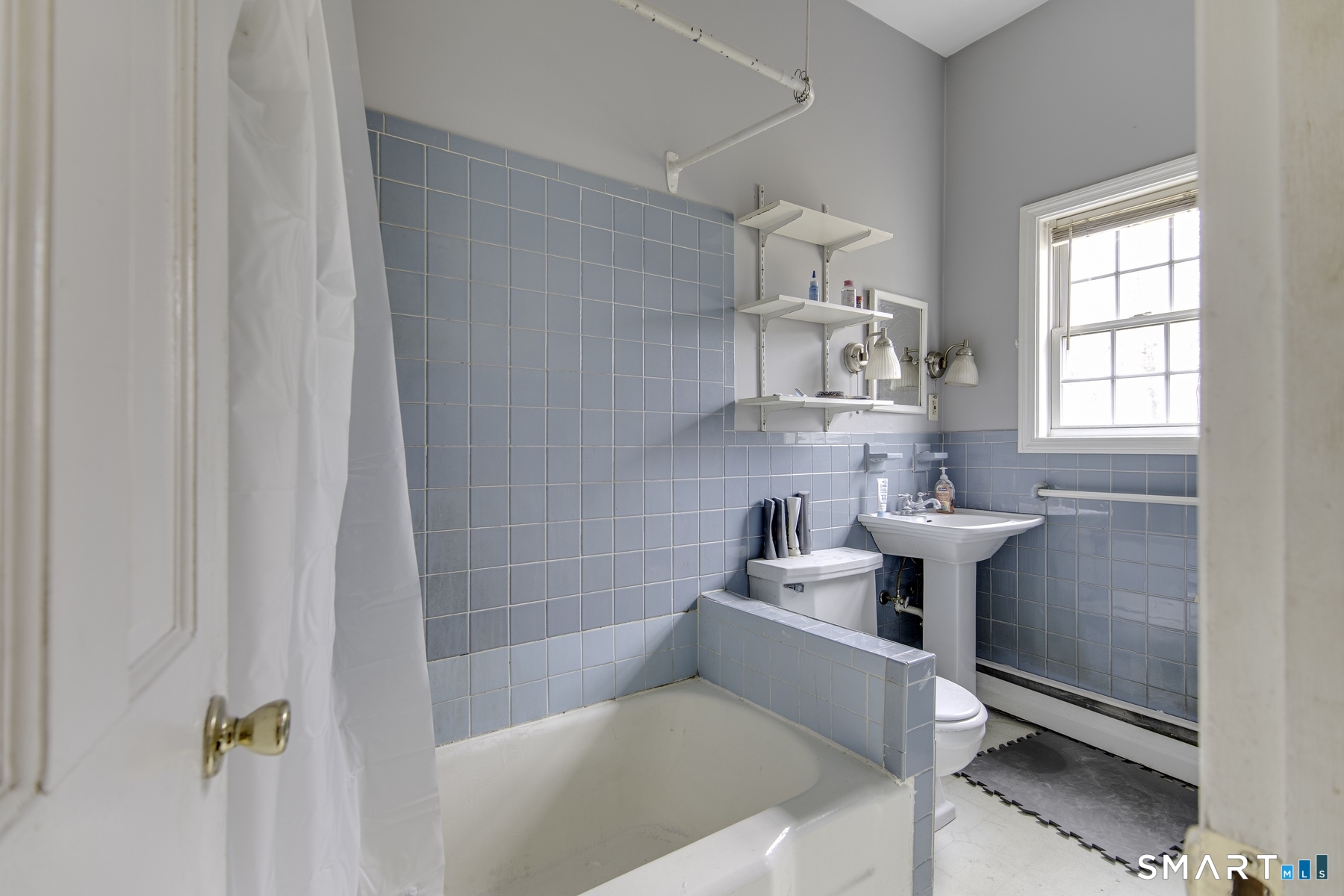 183 Sugar Street Newtown, CT 06470 - Photo 16 of 40 a bathroom with a sink mirror toilet and bathtub