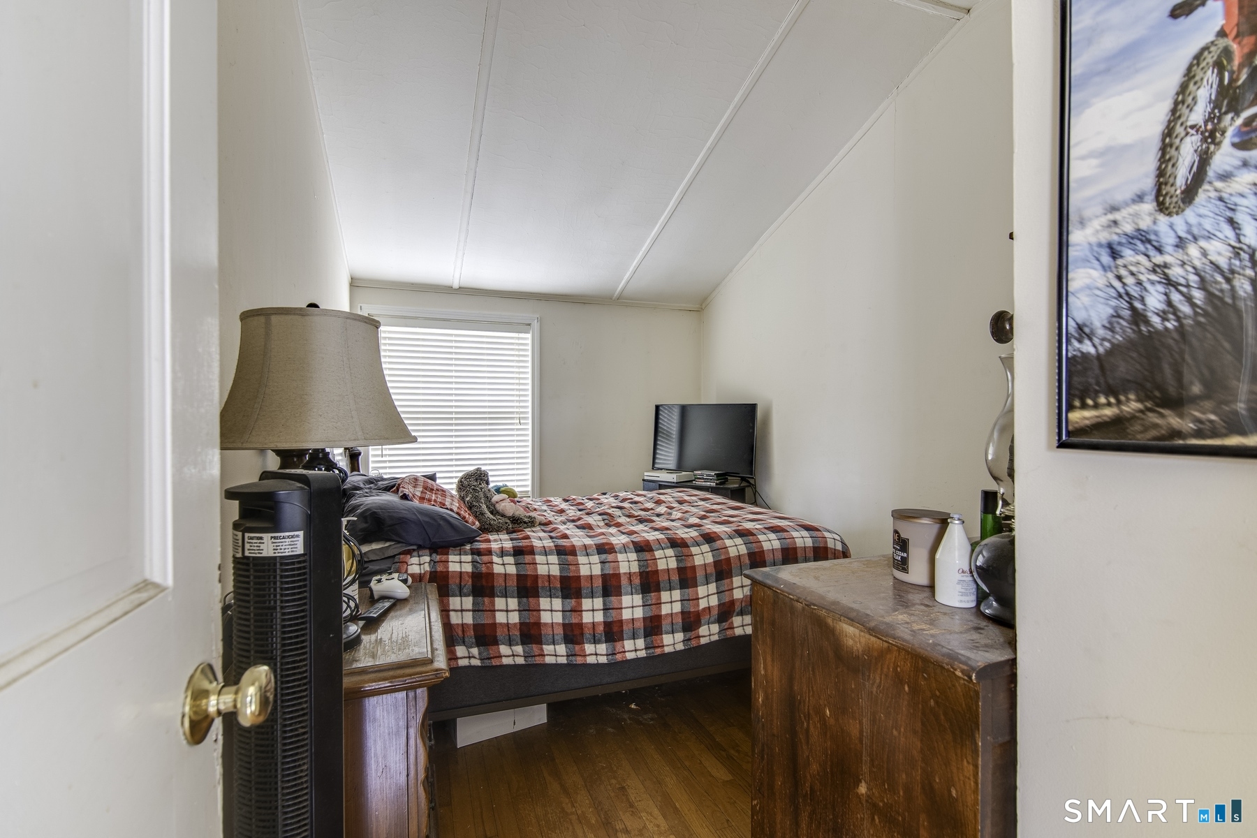 183 Sugar Street Newtown, CT 06470 - Photo 17 of 40 a bedroom with a bed and flat screen tv