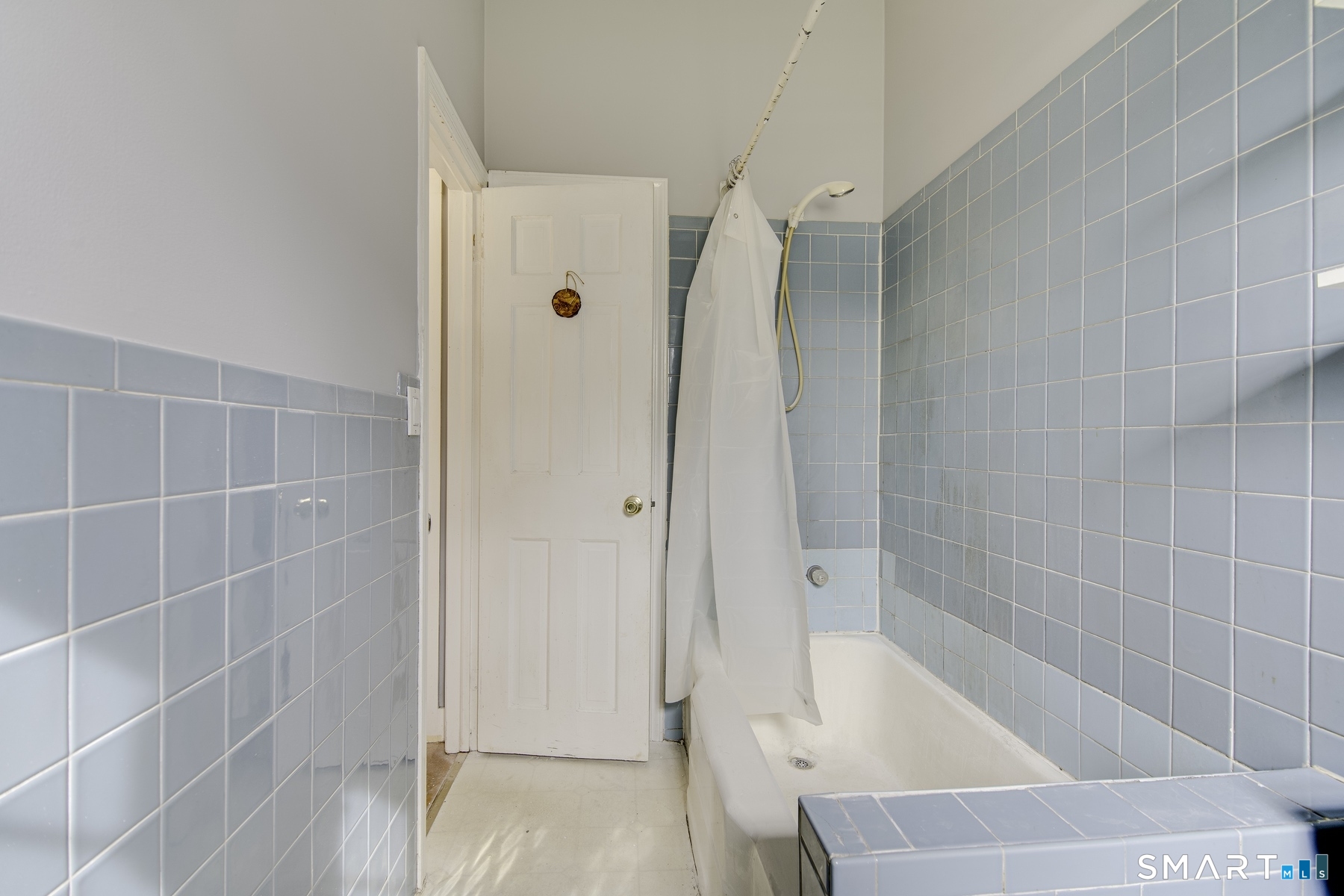 183 Sugar Street Newtown, CT 06470 - Photo 18 of 40 a bathroom with a bathtub and a shower