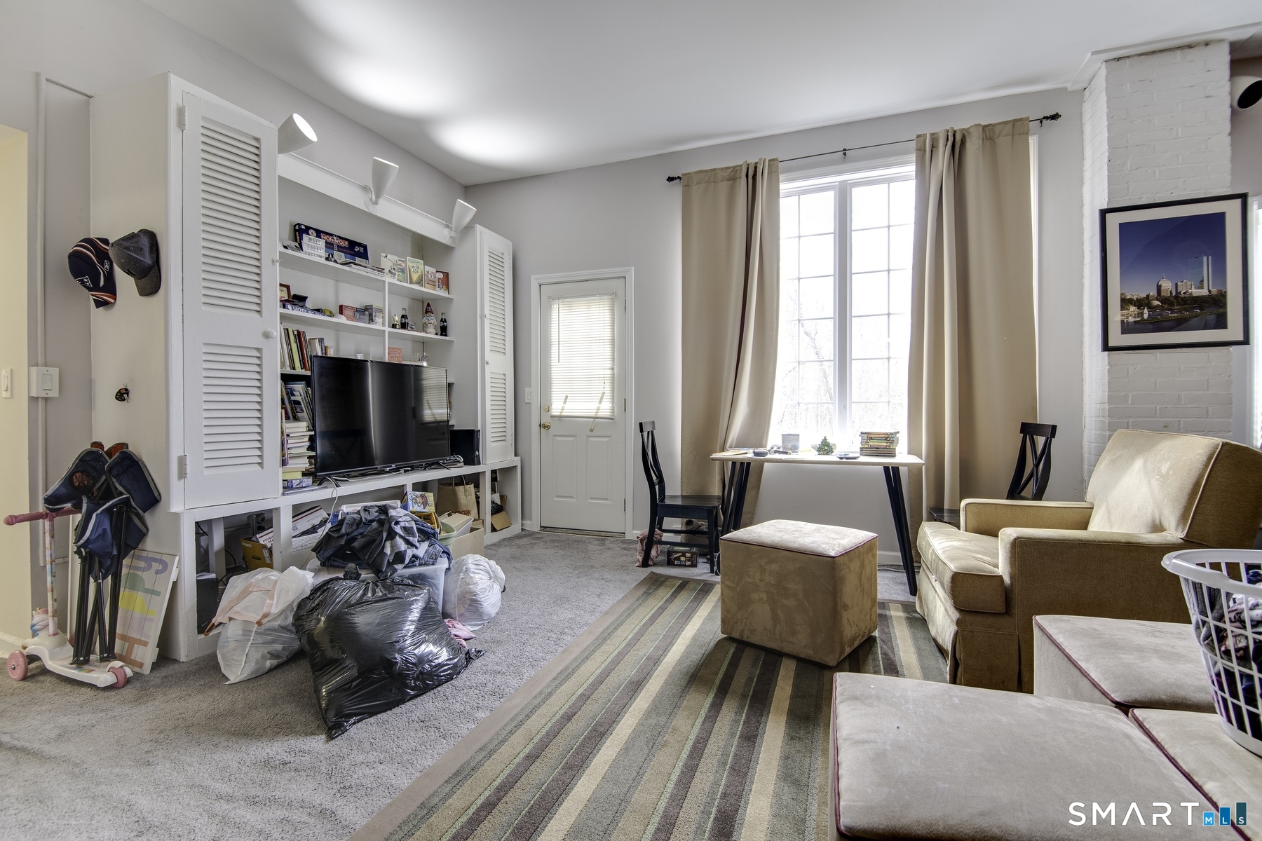 183 Sugar Street Newtown, CT 06470 - Photo 2 of 40 a bedroom with furniture and a flat screen tv