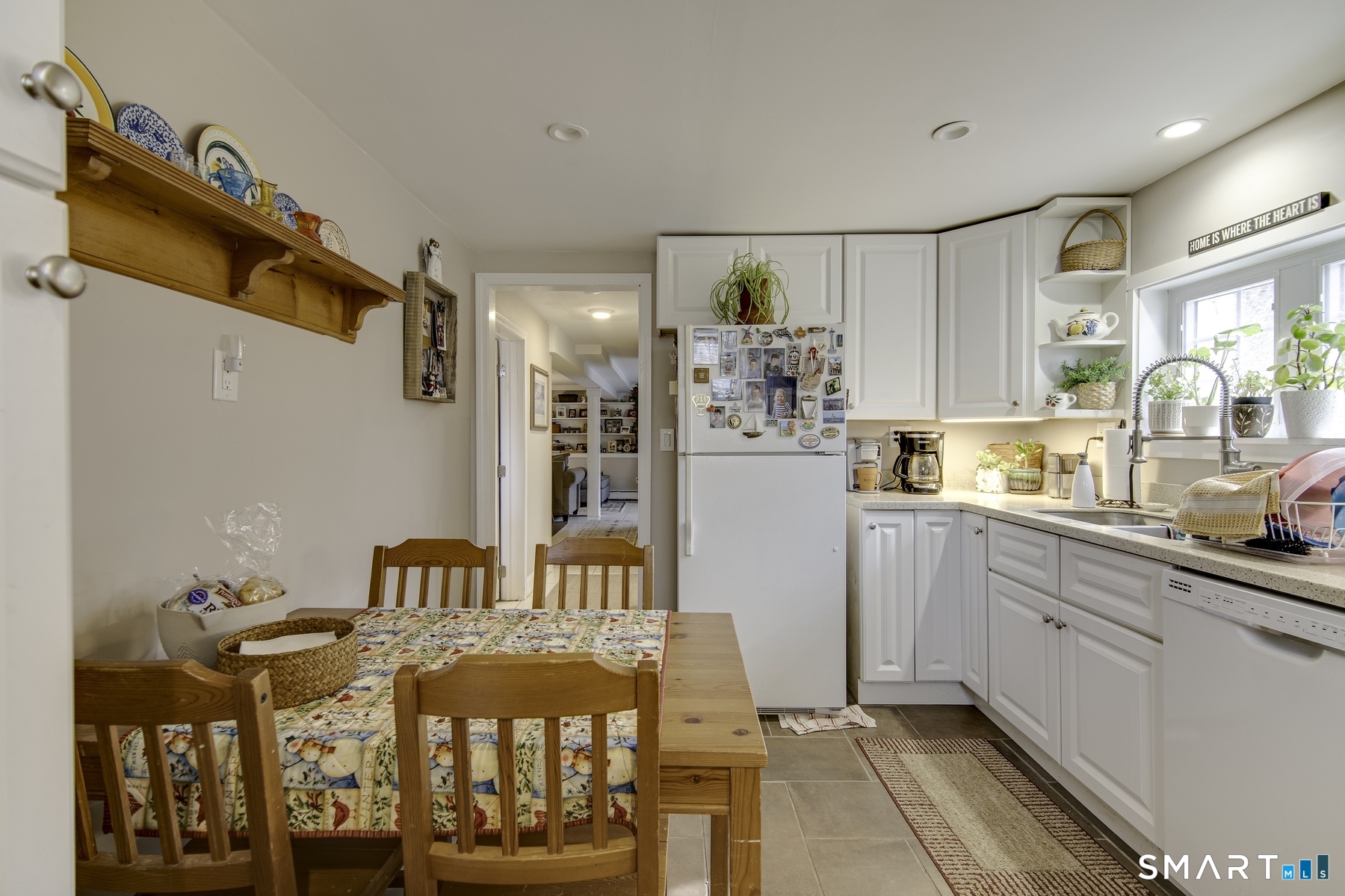 183 Sugar Street Newtown, CT 06470 - Photo 26 of 40 a kitchen with stainless steel appliances granite countertop a refrigerator and a sink