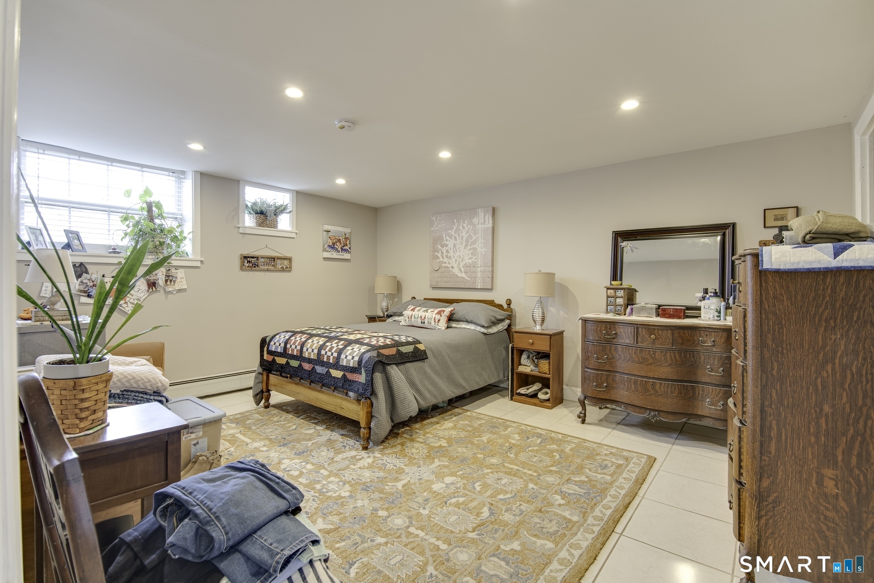 183 Sugar Street Newtown, CT 06470 - Photo 27 of 40 a bedroom with a bed and a couch