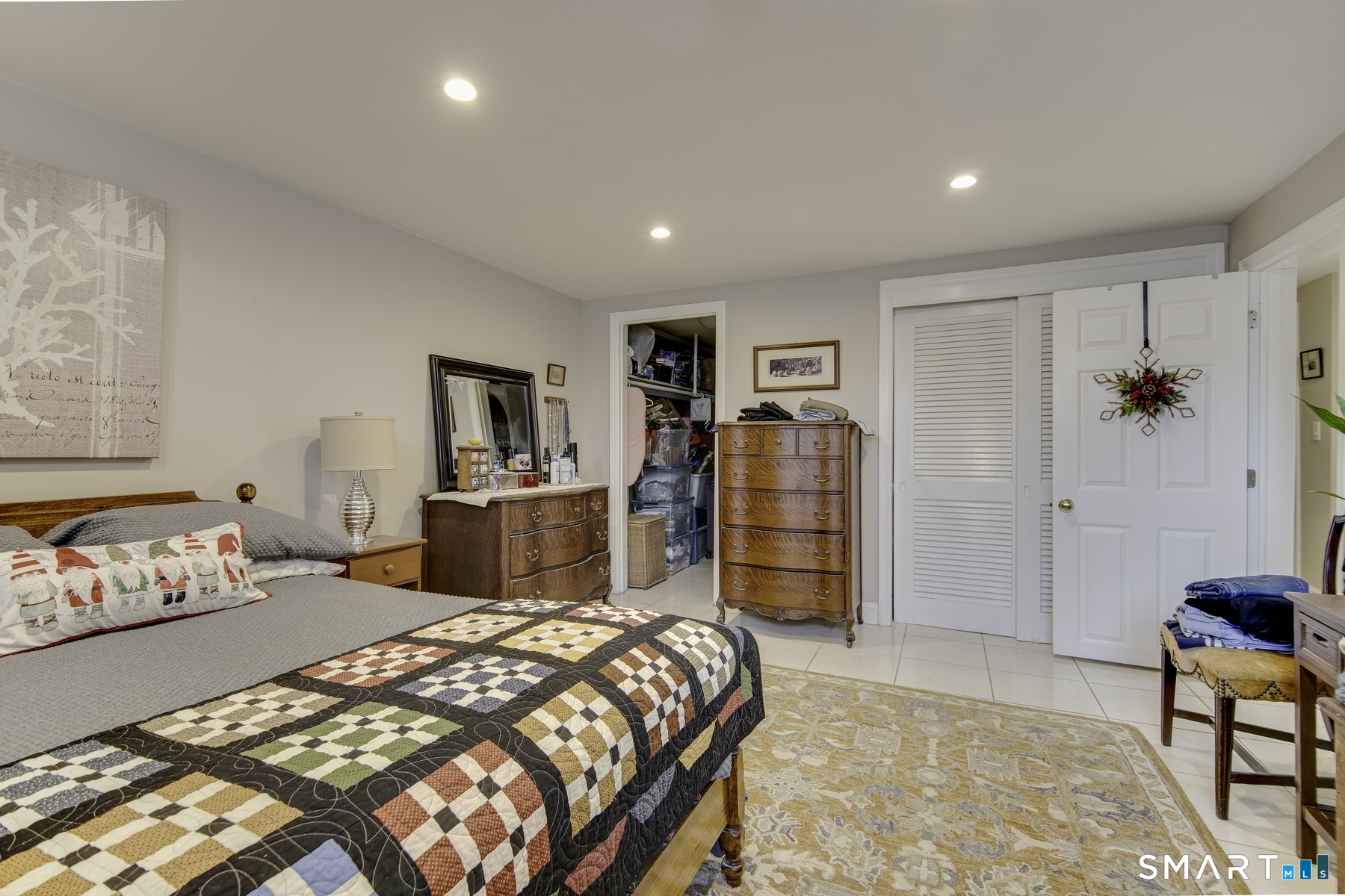 183 Sugar Street Newtown, CT 06470 - Photo 28 of 40 a bedroom with a bed and a couch