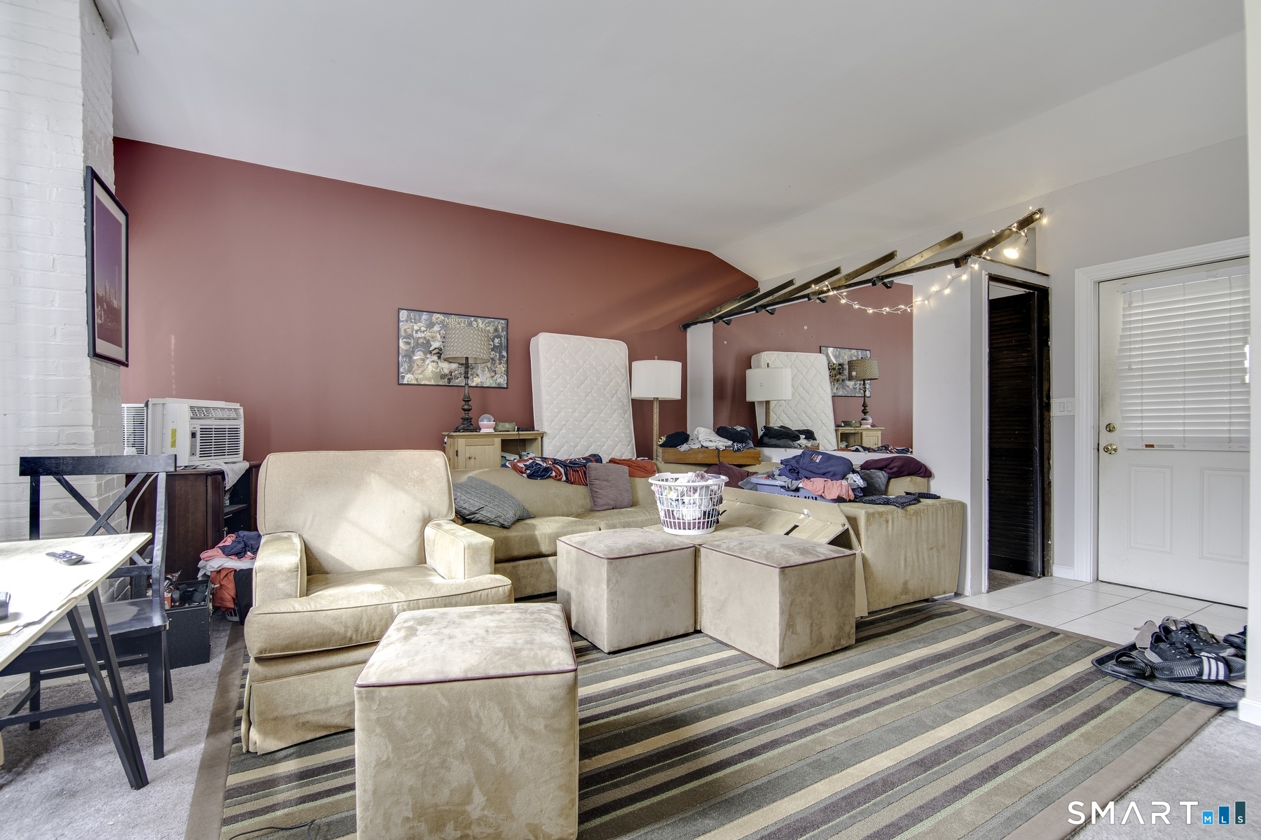 183 Sugar Street Newtown, CT 06470 - Photo 3 of 40 a living room with furniture and a fireplace