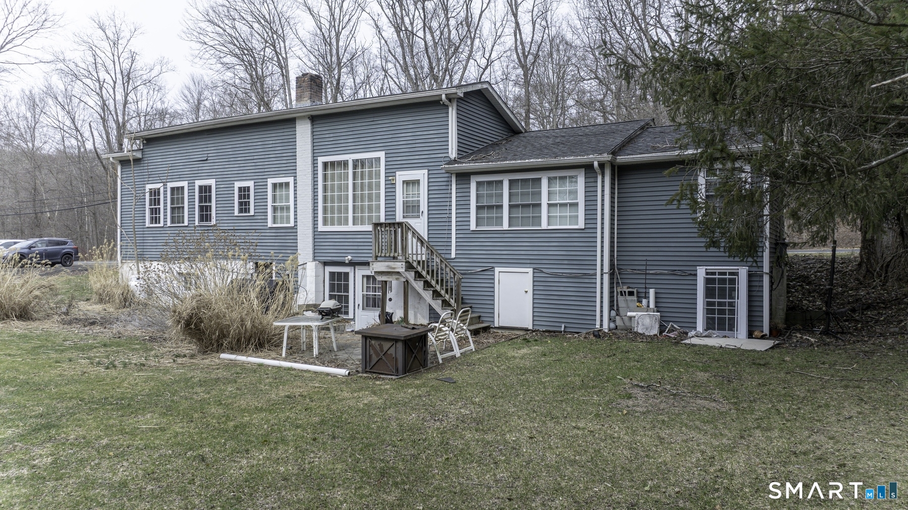 183 Sugar Street Newtown, CT 06470 - Photo 37 of 40 a view of a house with a yard and sitting area