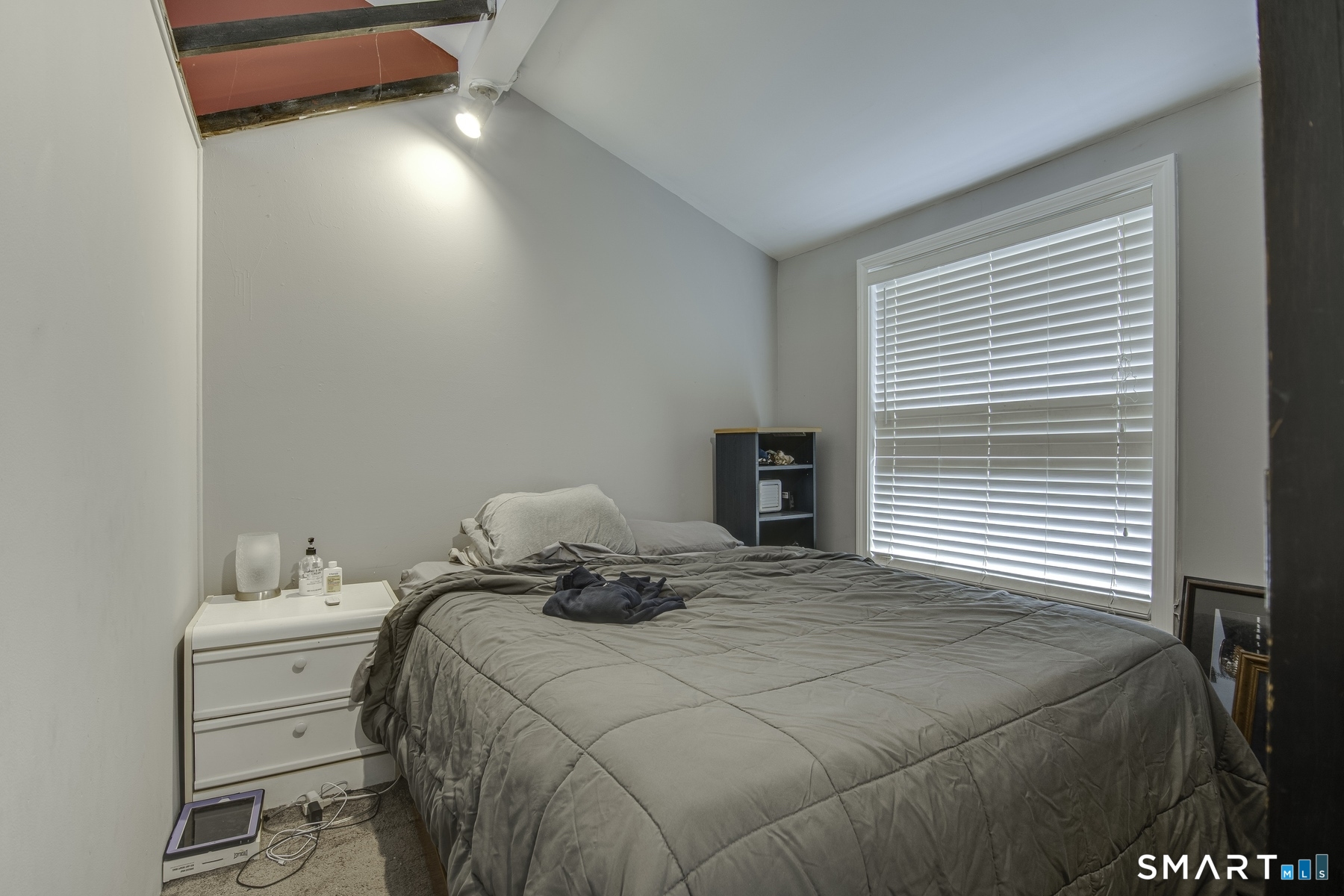 183 Sugar Street Newtown, CT 06470 - Photo 4 of 40 a bedroom with a bed and a window