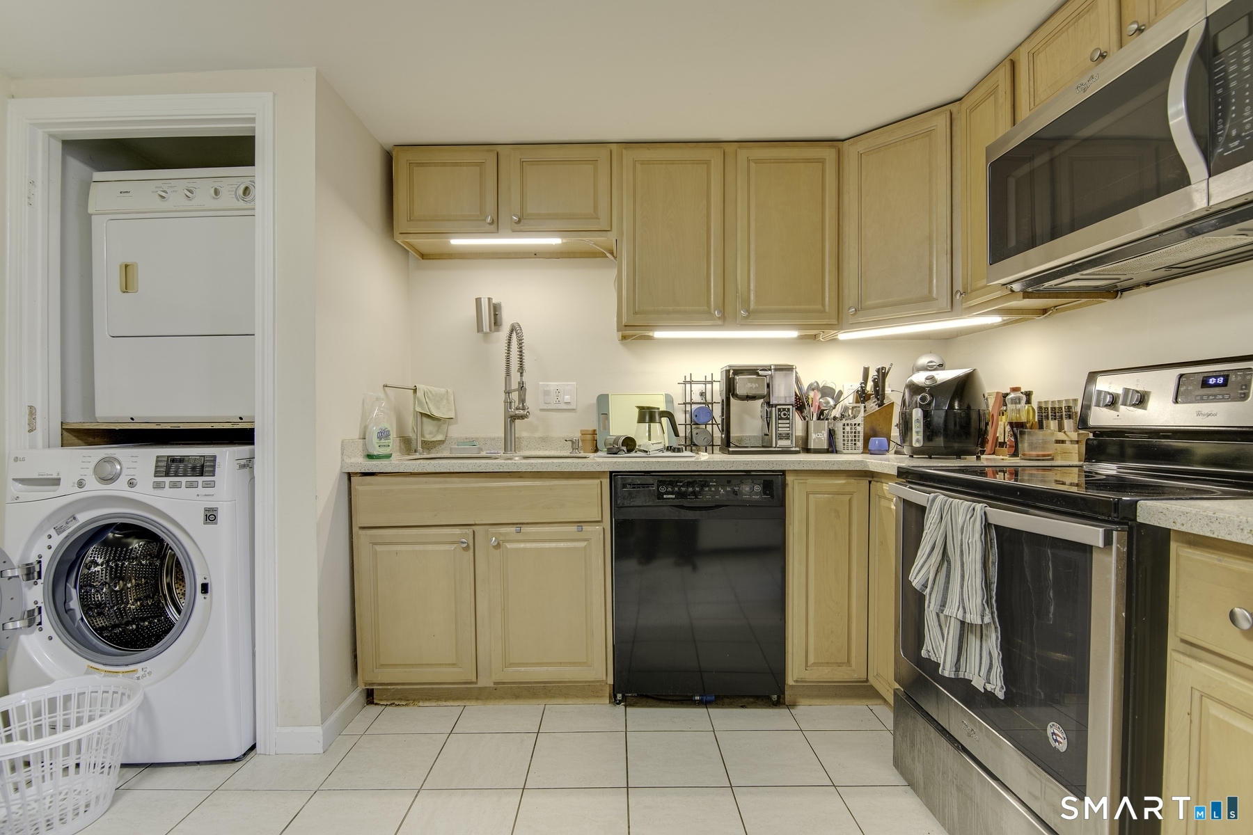 183 Sugar Street Newtown, CT 06470 - Photo 6 of 40 a kitchen with a sink a stove and cabinets