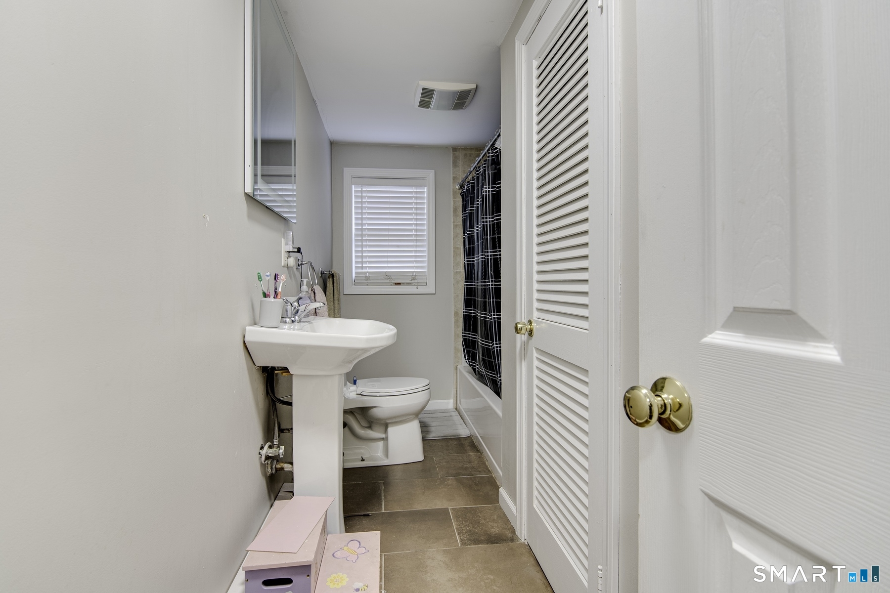 183 Sugar Street Newtown, CT 06470 - Photo 9 of 40 a bathroom with a sink toilet and mirror
