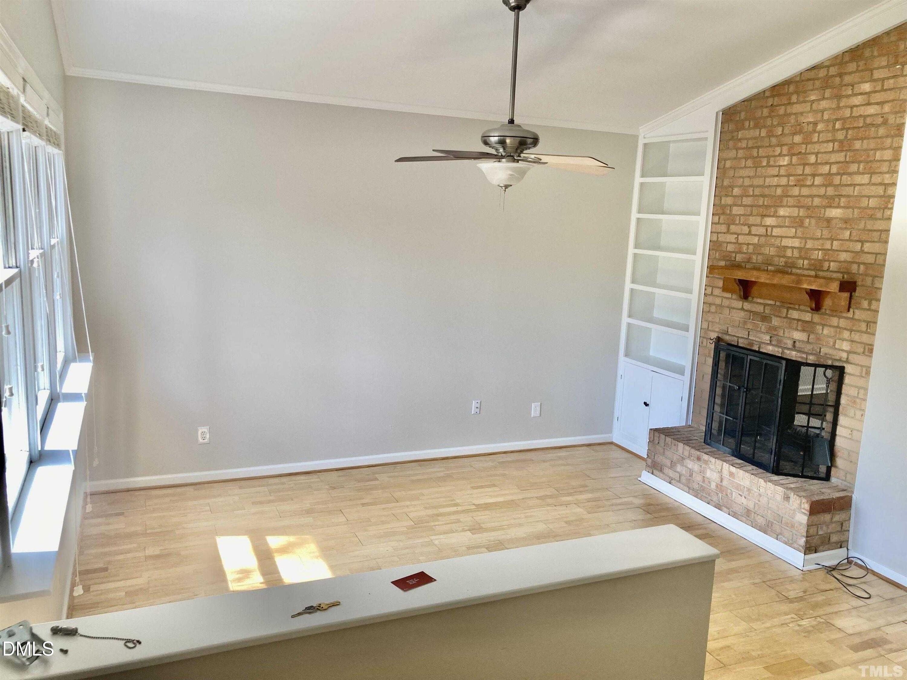 104 Castill Place Garner, NC 27529 - Photo 11 of 11 a room with a fireplace and a window