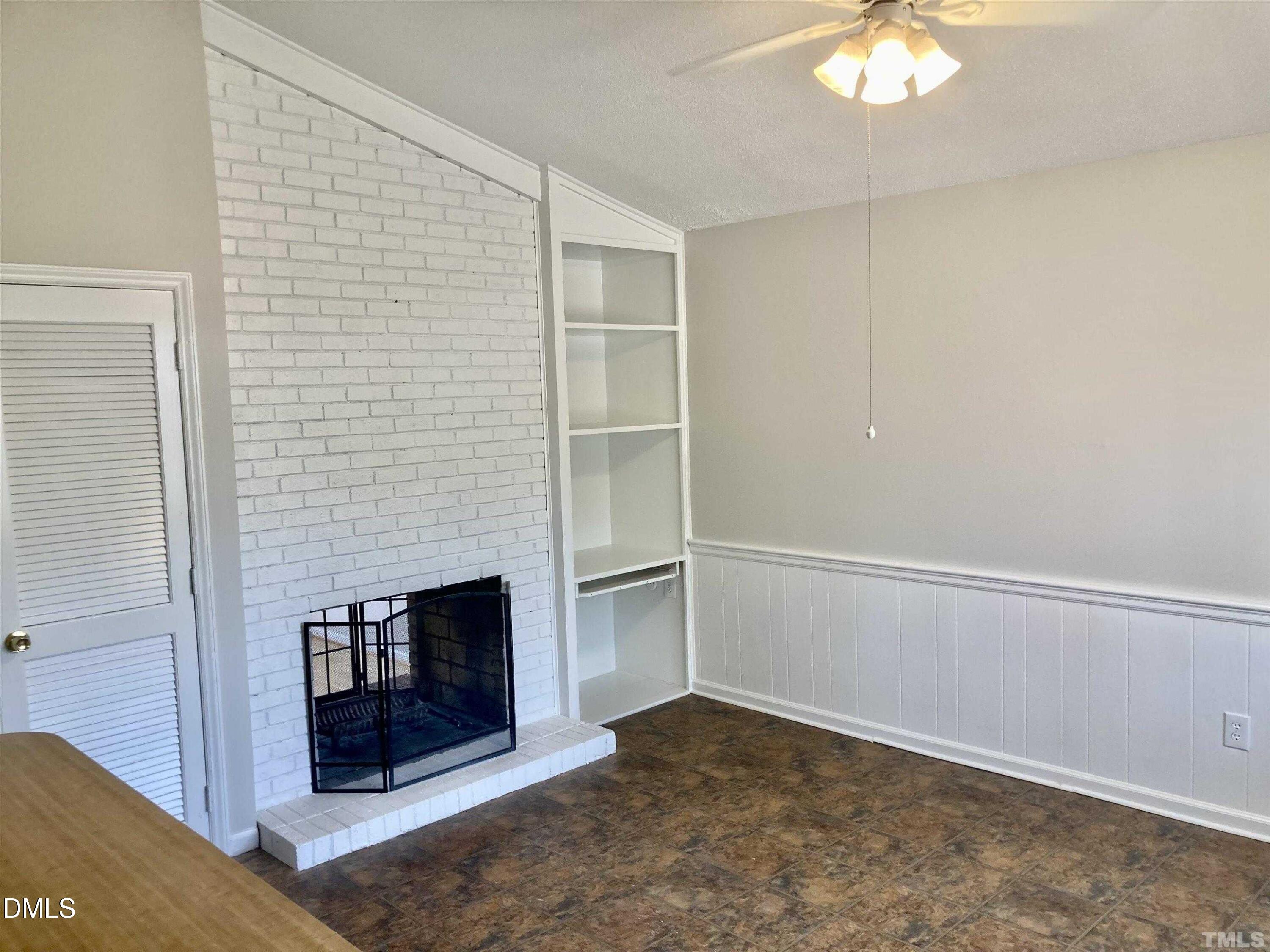 104 Castill Place Garner, NC 27529 - Photo 8 of 11 a view of an empty room with a fireplace