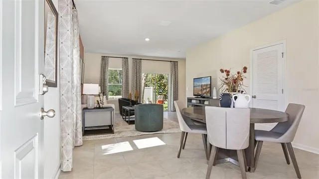 a view of a dining room with furniture window and wooden floor