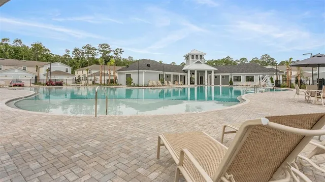 a view of a swimming pool with a patio