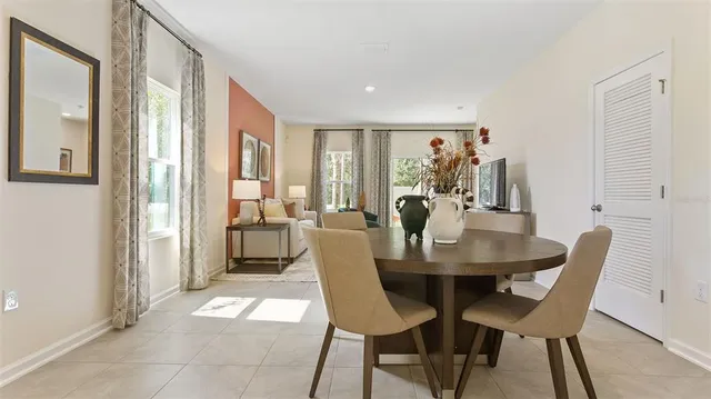 a view of a a dining room with furniture window and outside view