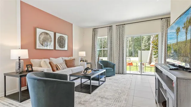 a living room with furniture and a flat screen tv