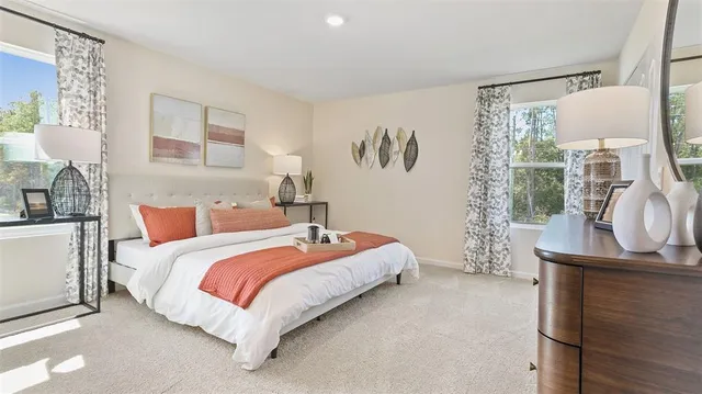 a bed room with a bed and a window