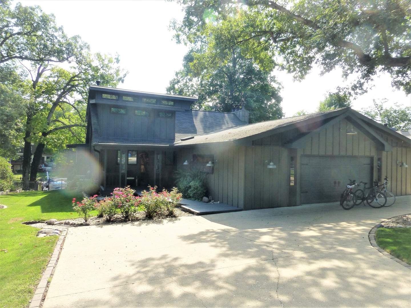 25306 Arrowhead Lane Hudson, IL 61748 - Photo 1 of 1 a front view of a house with a yard
