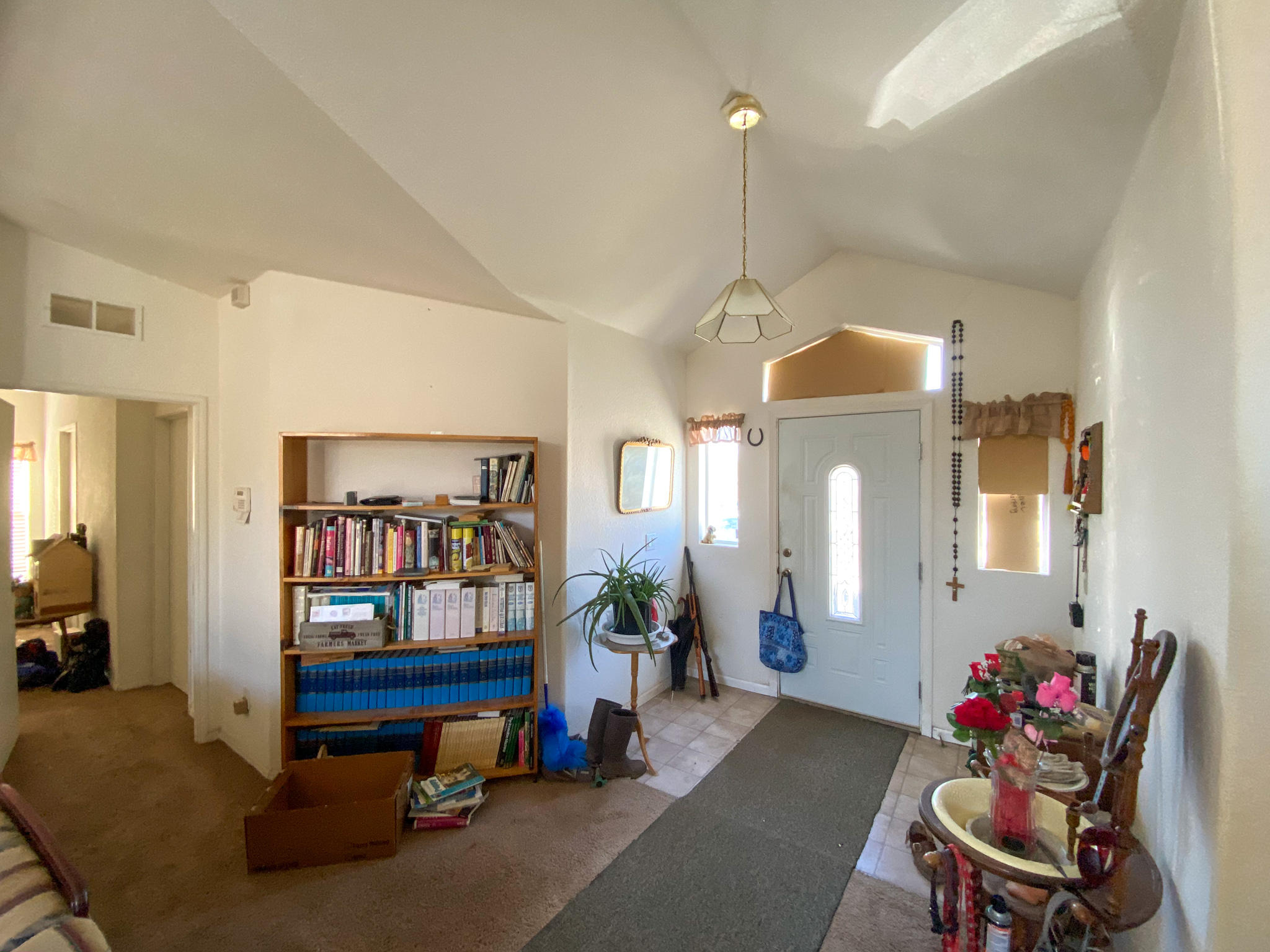 31668 Grindley Ranch Road Whitmore, CA 96096 - Photo 16 of 26 a living room with furniture gym equipment and a chandelier