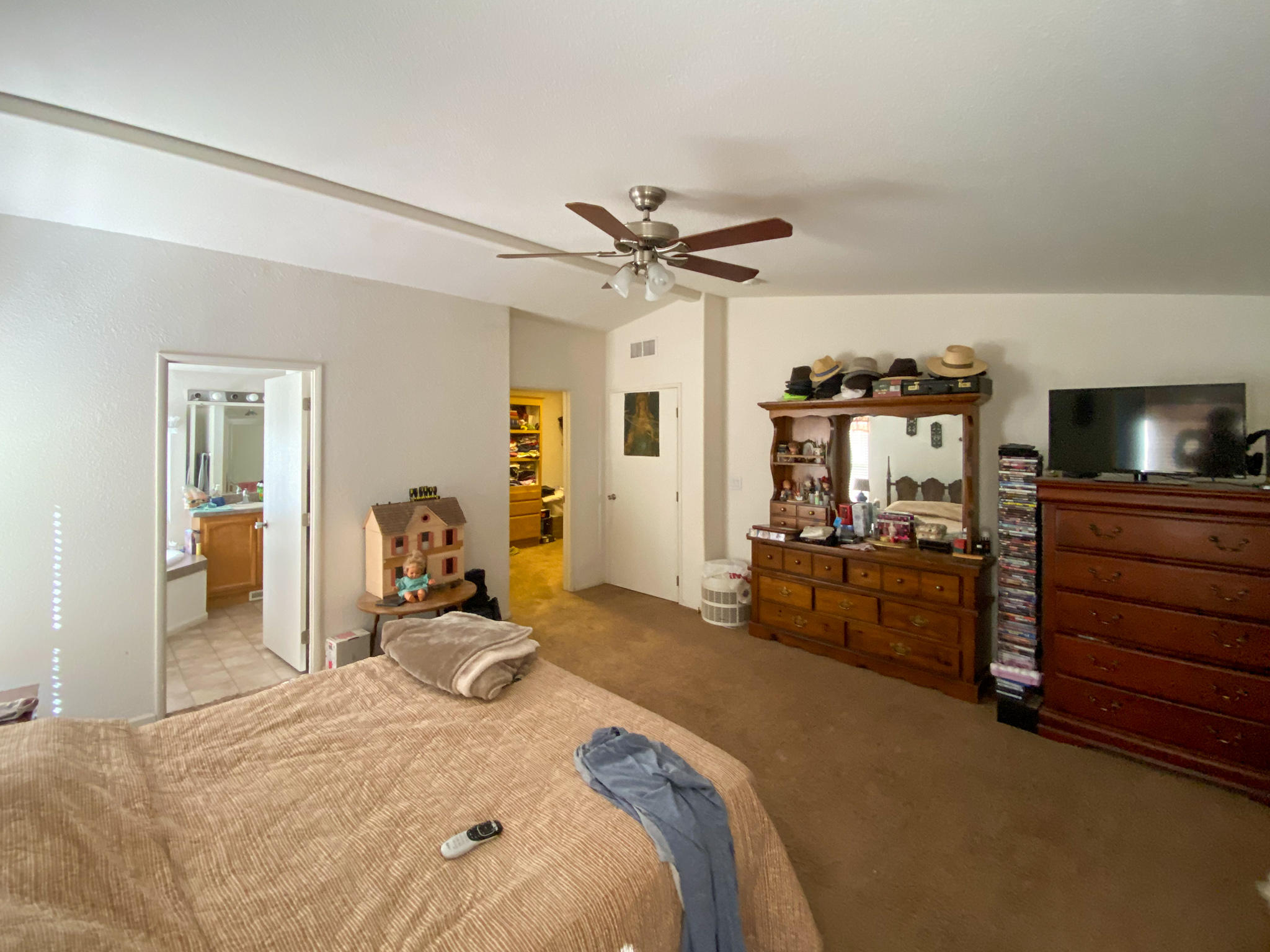 31668 Grindley Ranch Road Whitmore, CA 96096 - Photo 20 of 26 a bedroom with a bed and a tv on the dresser
