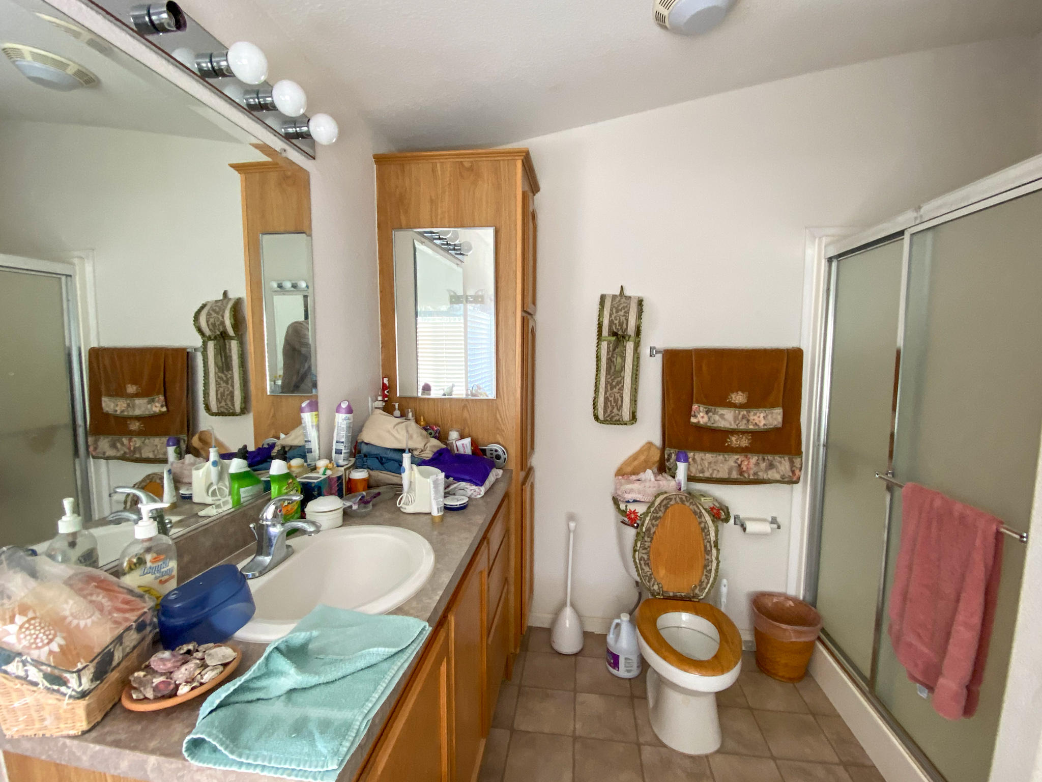 31668 Grindley Ranch Road Whitmore, CA 96096 - Photo 22 of 26 a bathroom with a granite countertop bathtub sink mirror and toilet
