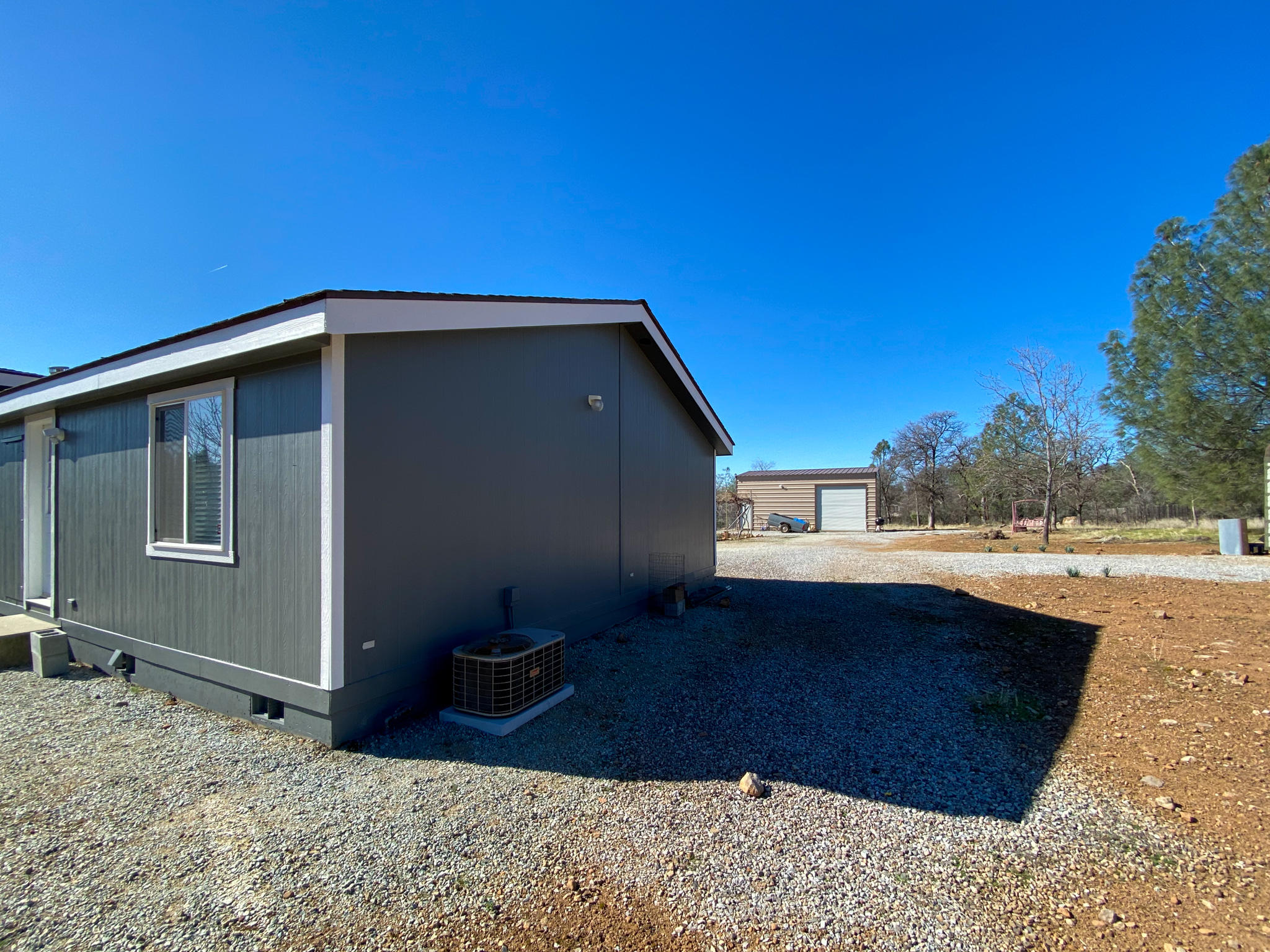 31668 Grindley Ranch Road Whitmore, CA 96096 - Photo 3 of 26 a view of a house with a backyard