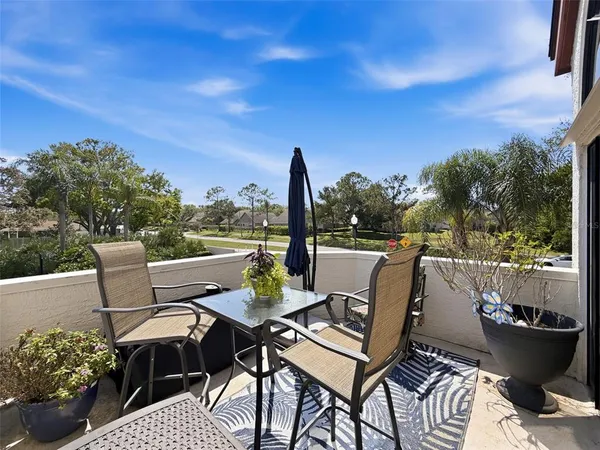 a view of an outdoor sitting area with furniture