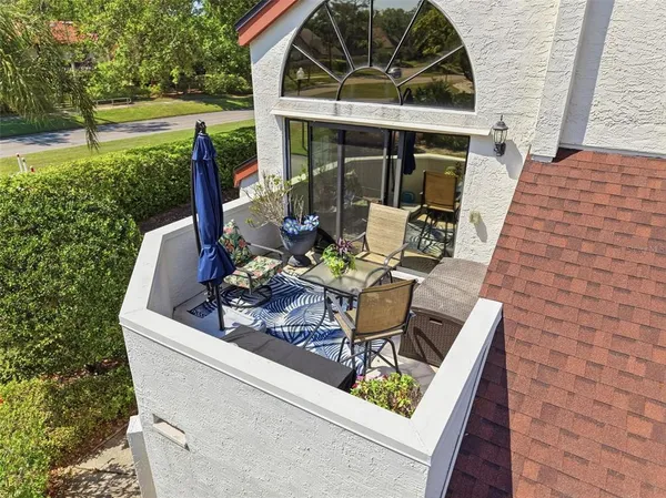 a bedroom with a bed and a flat tv screen