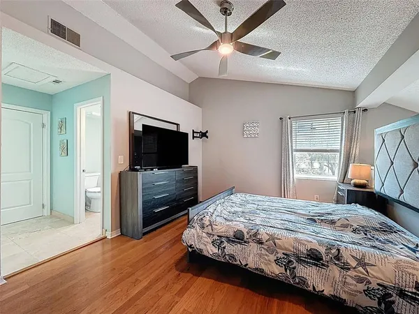 a bathroom with a toilet sink and shower